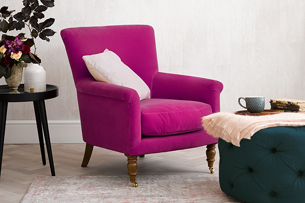 pink armchair and footstool